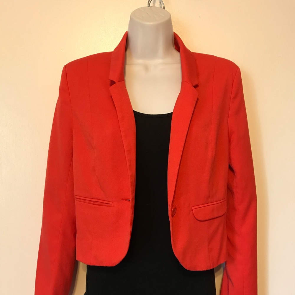 red/orange cropped blazer with polka dot interior